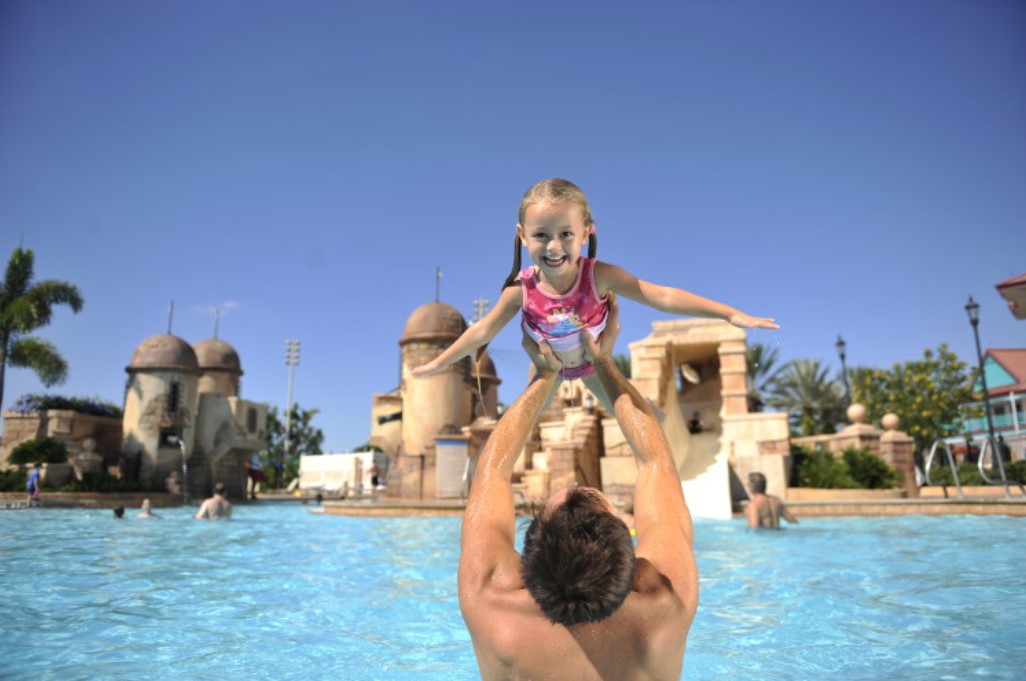 Exclusive Disney Resort Hotel Benefits - girl and dad in pool