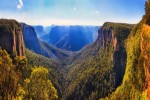 Bridal vale waterfall from Govett leap lookout towards Pulpit rock and surrounding sandstone mountain ranges in Blue Mountains on a sunny morning. shutterstock 1090685837