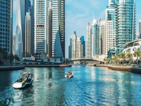 Panorama of Dubai Marina in UAE modern skyscrapers and port with luxury yachts. iStock 1266923176 banner