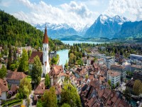 Panorama of Thun city in the canton of Bern with Alps and Thunersee lake Switzerland banner. iStock 1167011619