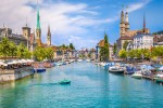 Panoramic view of historic Zurich city center with famous Fraumunster Grossmunster and St. Peter and river Limmat at Lake Zurich on a sunny day with clouds in summer Canton of Zurich Switzerland iStock 911713238