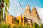 Pyramids near the Nile River at sunset iStock 1300812145 banner