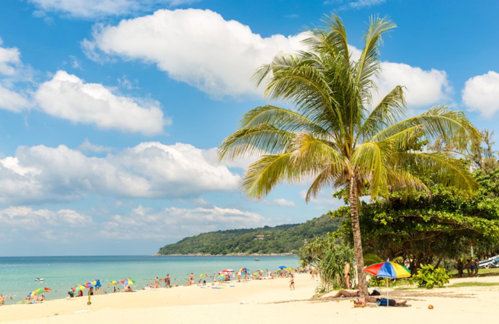Thailand beach with people suntanning