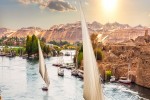 Traditional Nile sailboats near the banks of Aswan Egypt. iStock 1327507461 banner