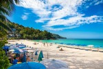 Unidentified people are relaxing on Kata beach during a sunny day in Phuket Thailand. shutterstock 781380613