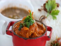 Creole Chicken and Prawn Curry with Coconut Milk srved with Basmati rice and lentils banner iStock 1479583489