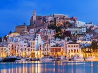 Ibiza Dalt Vila downtown at night with light reflections in the water Ibiza Spain. iStock 962867192