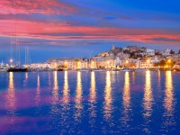 Ibiza island night view of Eivissa town and sea lights reflection iStock 134938255