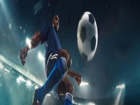 Professional football or soccer player in action on stadium with flashlights kicking ball for winning goal wide angle. Concept of sport competition motion overcoming.banner iStock 1219371106