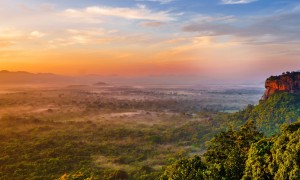 Sunrise view to Sigiriya rock Lion Rock from Pidurangala Rock in Sri Lanka banner iStock 1133441880