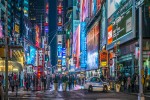 Time Square in New York city by night banner iStock 523538287