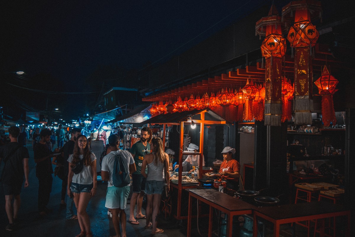 People walking in a Thailand food market